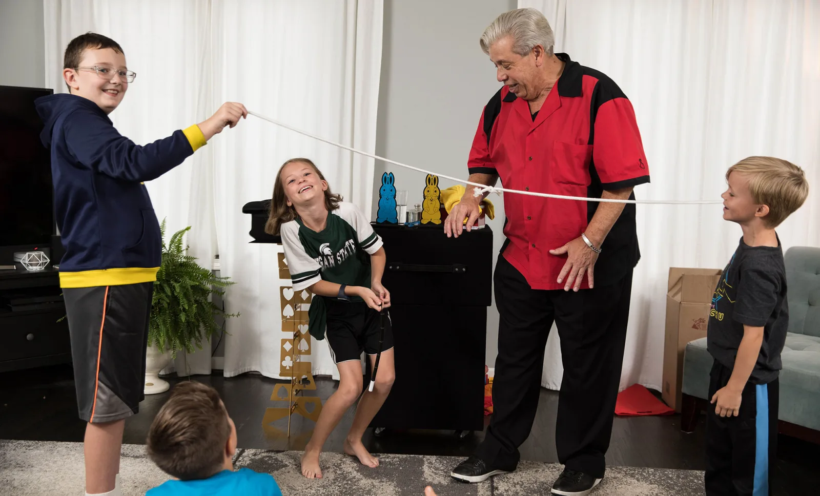 Kids amazed at a birthday party magic show
